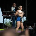 Public titty flashing in outdoor concert - Photo #1