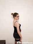 Beautiful college girl teasing in black stockings - Photo #1