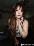 Perfect Asian sweetie removes her sexy skirt - Photo #12