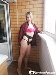 Incredible MILF displaying her tits by the window - Photo #8