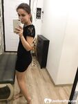 Kinky brunette taking pics while stripping her clothes - Photo #1