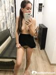 Kinky brunette taking pics while stripping her clothes - Photo #18