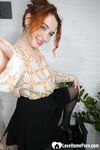 Stunning redhead in stockings shows off her ass - Photo #16