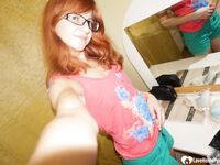 Hot redhead tries on a sexy maid costume - Photo #3