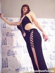 MILF in a seductive purple dress fooling around - Photo #20