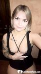 Cute tattooed beauty flashes her amazing tits - Photo #7