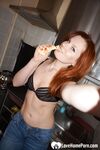 Redhead beauty looks fantastic in pantyhose and stockings - Photo #2
