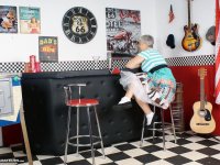 Old American lady Savana exposes her big butt in basement bar - Photo #1