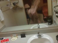 Sporty girlfriend taking a shower and fingering her shaved cunt - Photo #15