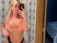 Sultry blonde takes self shots while sporting a strapon cock - Photo #1