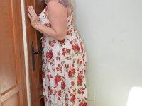 Older blonde BBW Melody plays with her large boobs in her bedroom - Photo #3