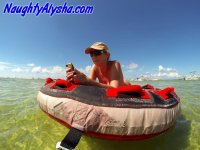 Big titted amateur lounges on an air mattress while naked in a ball cap - Photo #2