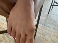 Amateur girl with red fingernails highlights her bald pussy in a red dress - Photo #5