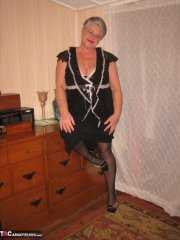 Overweight nan Girdle Goddess strips to her footwear in front of a dresser