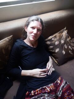 44-year-old Shelly on the brown couch.