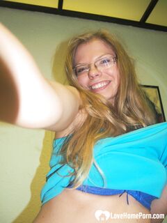Brunette teacher with glasses shows off her boobs