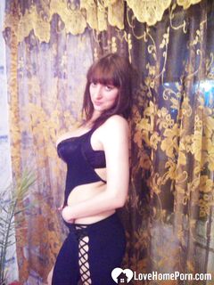 MILF in a seductive purple dress fooling around