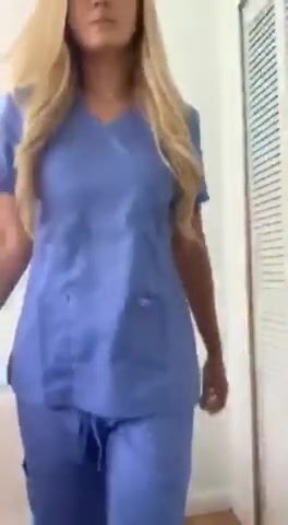 Drop dead gorgeous nurse taking a break at work
